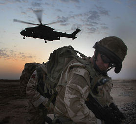 British military personnel and helicopter. (credit: Getty images)