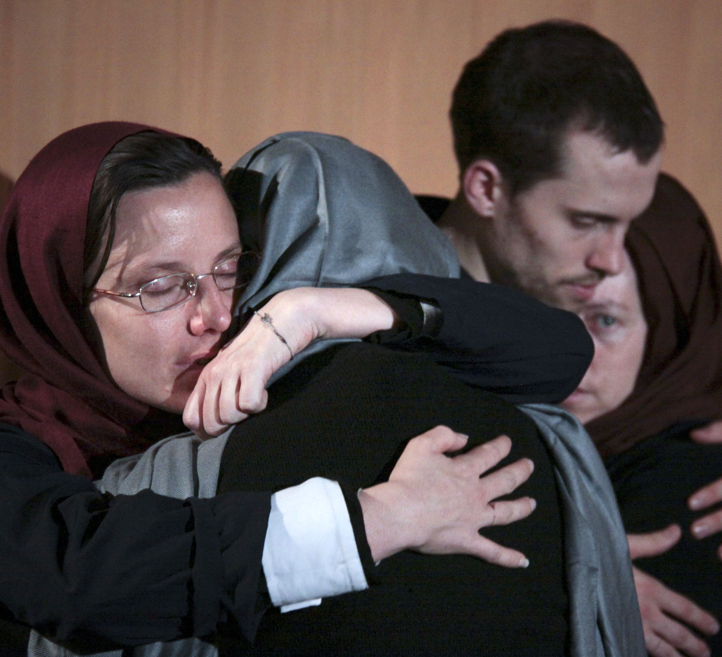Prisoners hug their mothers during a visit in Tehran May 2010 (credit: Reuters)