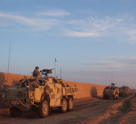 The BRF vehicles outside a compound, Nad e Ali district.