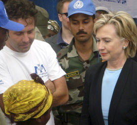 Hillary Clinton meets a victim of rape during a visit to Africa (Credit: Reuters)