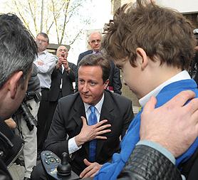 David Cameron is confronted by the parent of a disabled child on education policy (Reuters)