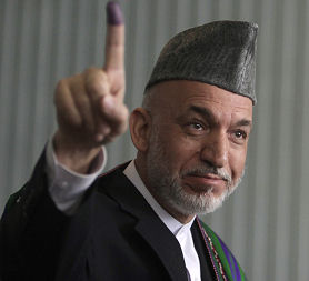 Hamid Karzai after voting in the presidential election (Reuters)