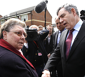 Gordon Brown is caught off guard by a microphone calling this voter a bigot (Reuters)